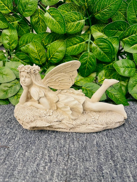 Laying angel statute