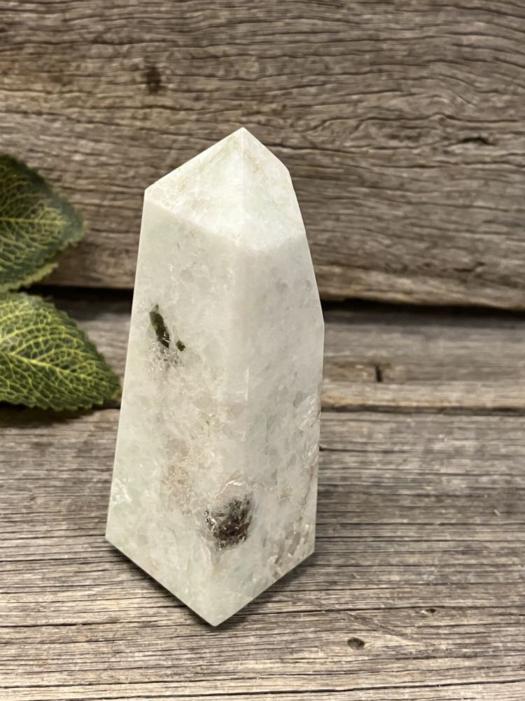 Amazonite tower with garnet and green tourmaline inclusions