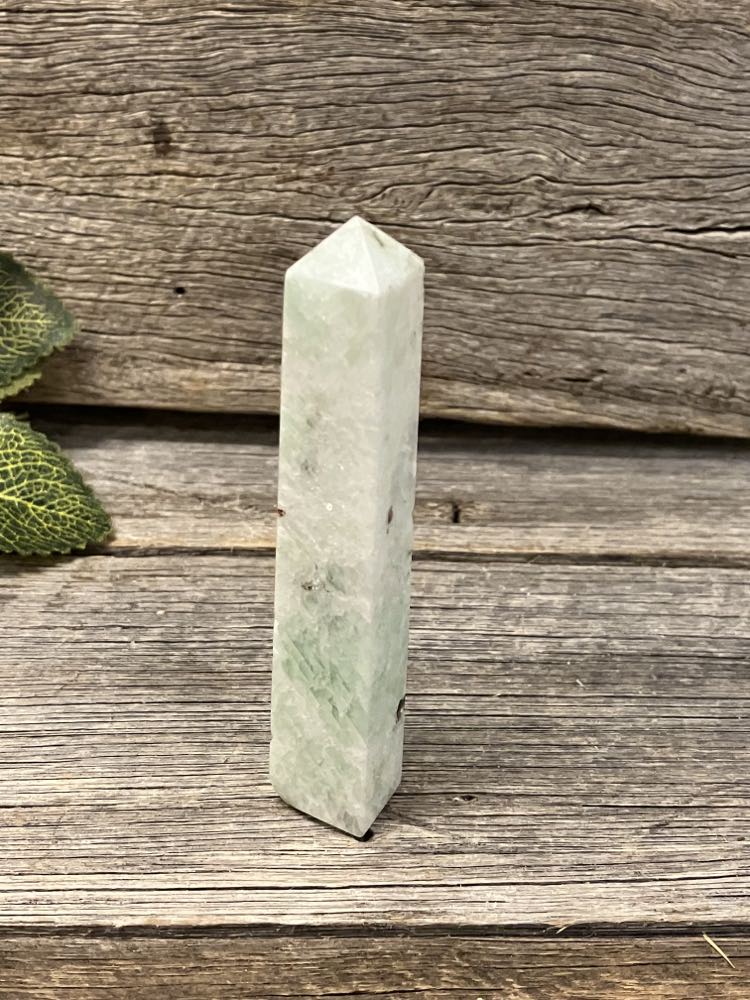 Amazonite tower with garnet and green tourmaline inclusions