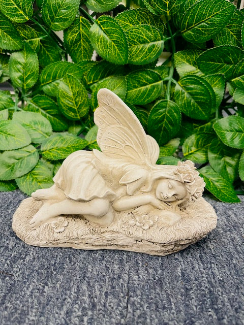 Laying angel statute